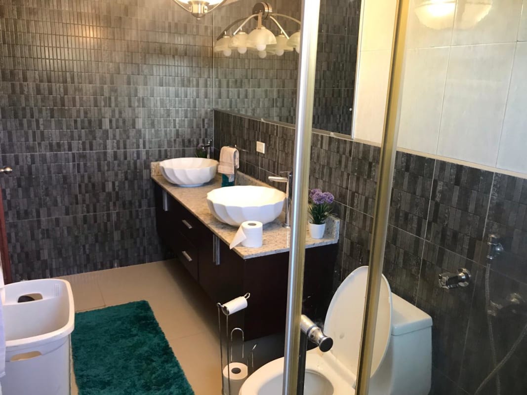 Bathroom double vessel sinks, granite vanity and glass shower El Doral Betania Panama