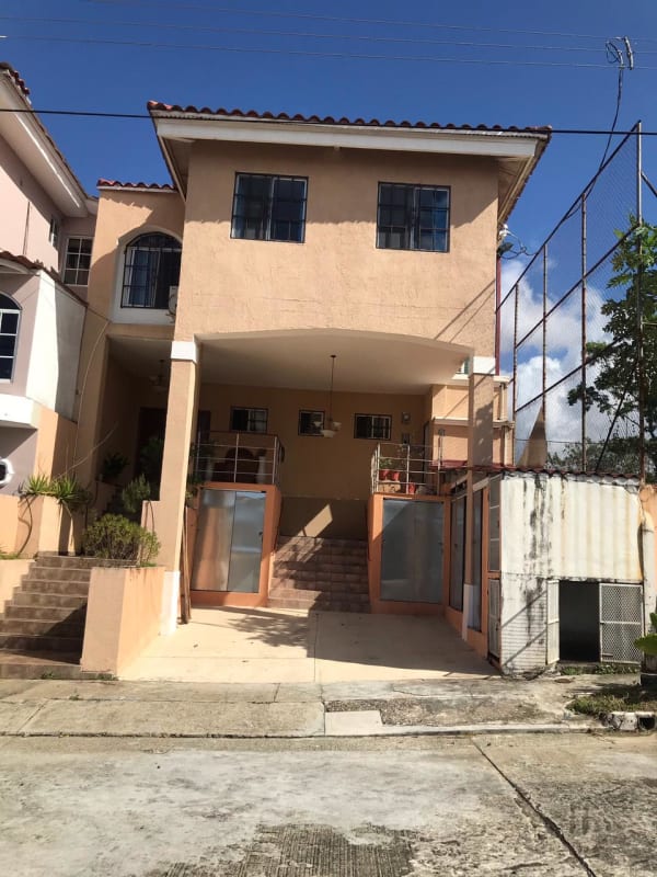 Bedroom with bed, ceiling fan, split AC and floral curtains in El Doral Betania Panama