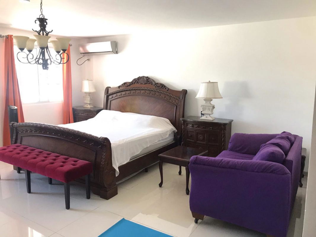 Kitchen with granite countertops, stainless appliances and mosaic tile El Doral Betania