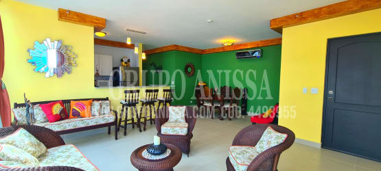 Contemporary kitchen with granite countertops and breakfast bar at PH Playa Corona Panama