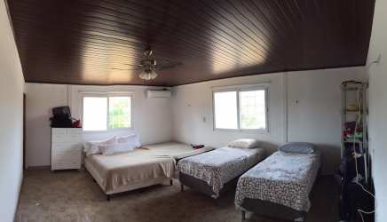 Workers’ housing at agricultural ranch in Panama with hill surroundings