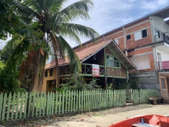 Dock on calm Caribbean waters with hillside view in Isla Grande Portobelo Panama