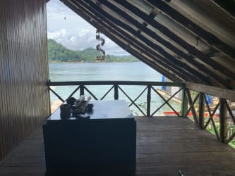 Rustic wooden balcony overlooking Caribbean ocean Isla Grande Panama