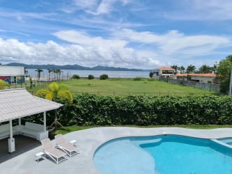 Condominium pool surrounded by gardens with beachfront in Punta Chame Panama for sale