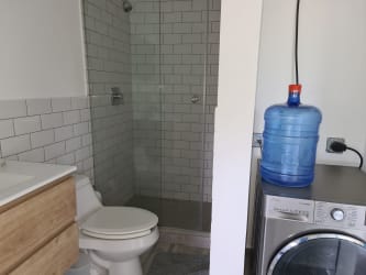 Multi-functional bathroom with laundry appliances Punta Chame beach condo Panama