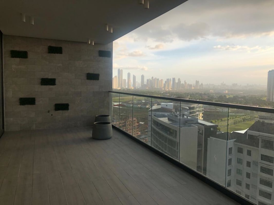 Large balcony with glass railing overlooking golf course Empire Residences Santa Maria Panama