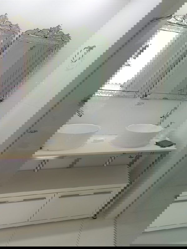 Modern bedroom with designer decor upholstered bed mirrored nightstands in Yoo Panama Avenida Balboa