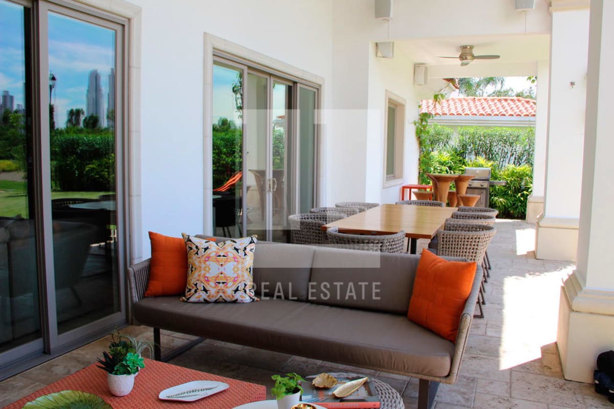 Modern kitchen with granite countertops stainless appliances and breakfast bar in luxury home Santa Maria Panama