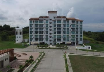 Modern multi-story boutique condo with glass balconies and oceanfront location at PH Coral Fontanella San Carlos Panama