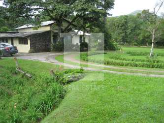 Natural stream with mature tropical trees on estate in El Valle de Antón Panama