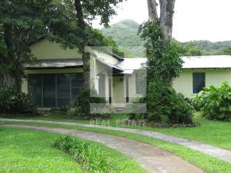 Expansive garden and lawns with mature trees and lush greenery on private estate in El Valle Panama
