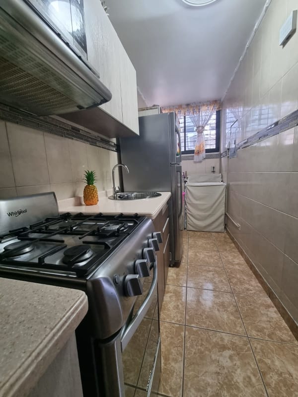 Open plan living dining area with tile floors in PH Carrasquilla Panama