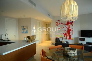 Modern kitchen with breakfast island and dining space in oceanview Buenaventura Panama condo