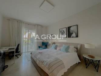 Master bedroom with ocean view, natural light, ensuite bathroom at Buenaventura condo