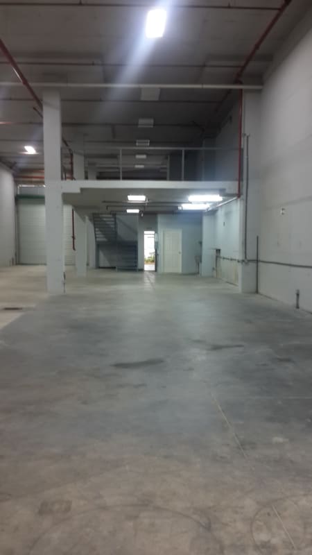 Interior view of office mezzanine with tiled floors and drop ceilings inside warehouse for lease Panama