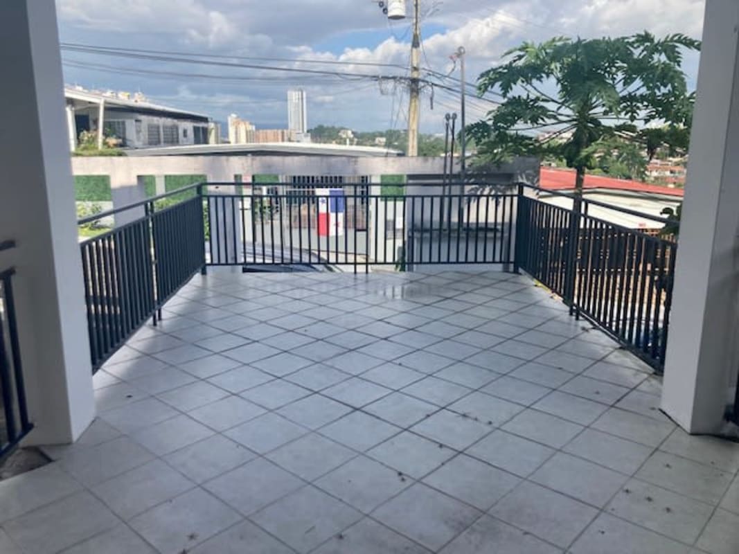 Spacious tiled balcony with metal railing overlooking Betania neighborhood Panama City