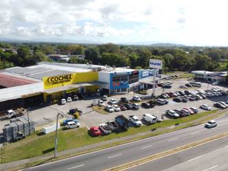 Aerial shot of multi-tenant retail center with large parking lot in Bugaba Chiriqui Panama
