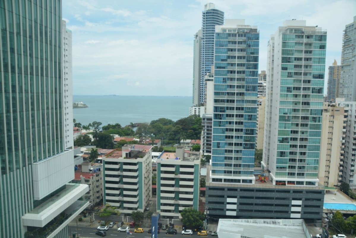 Aerial perspective of Punta Paitilla high-rise towers with ocean backdrop Panama City