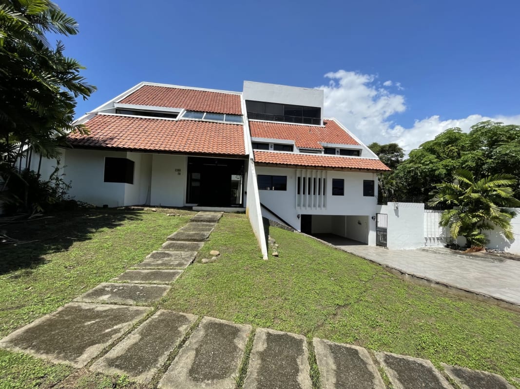Front exterior of upscale two-level house for sale in Coco del Mar San Francisco Panama