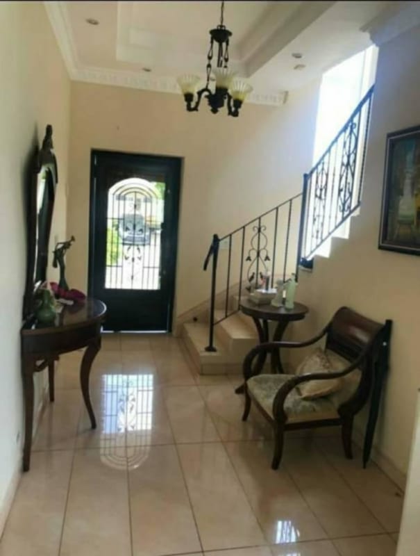 Traditional dining room with chandelier and large windows at Royal Country Condado del Rey Panama