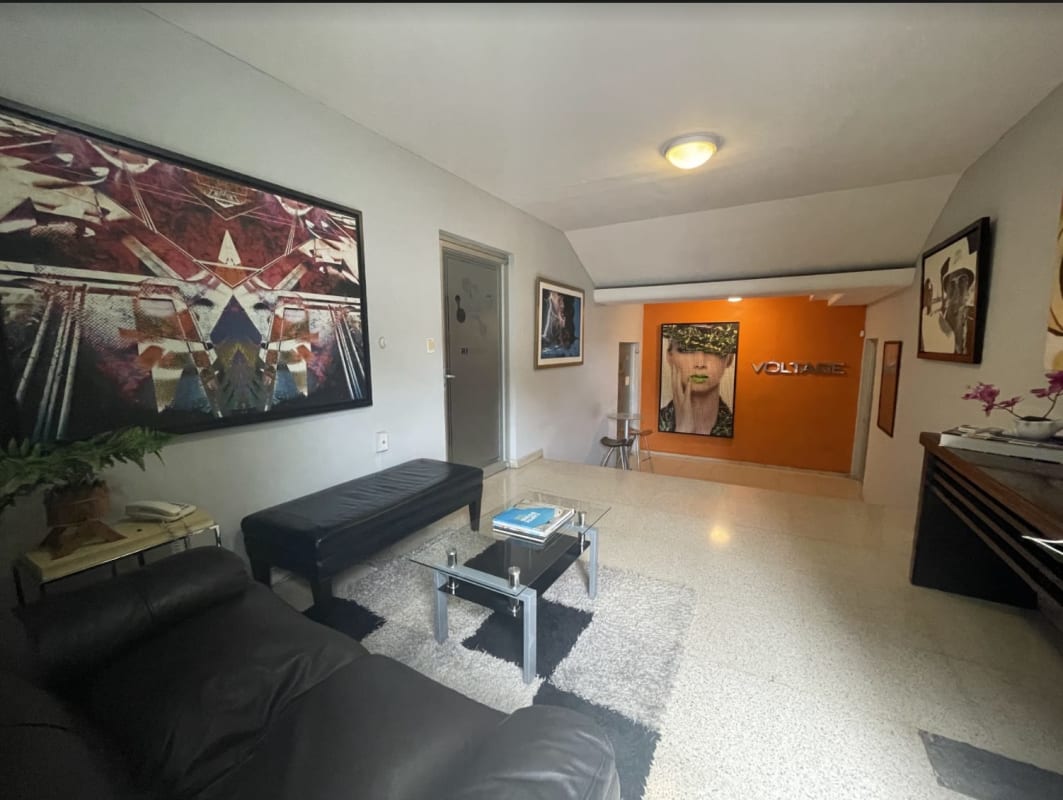 Minimalist modern office space with work desks, neutral colors in Coco del Mar Panama City