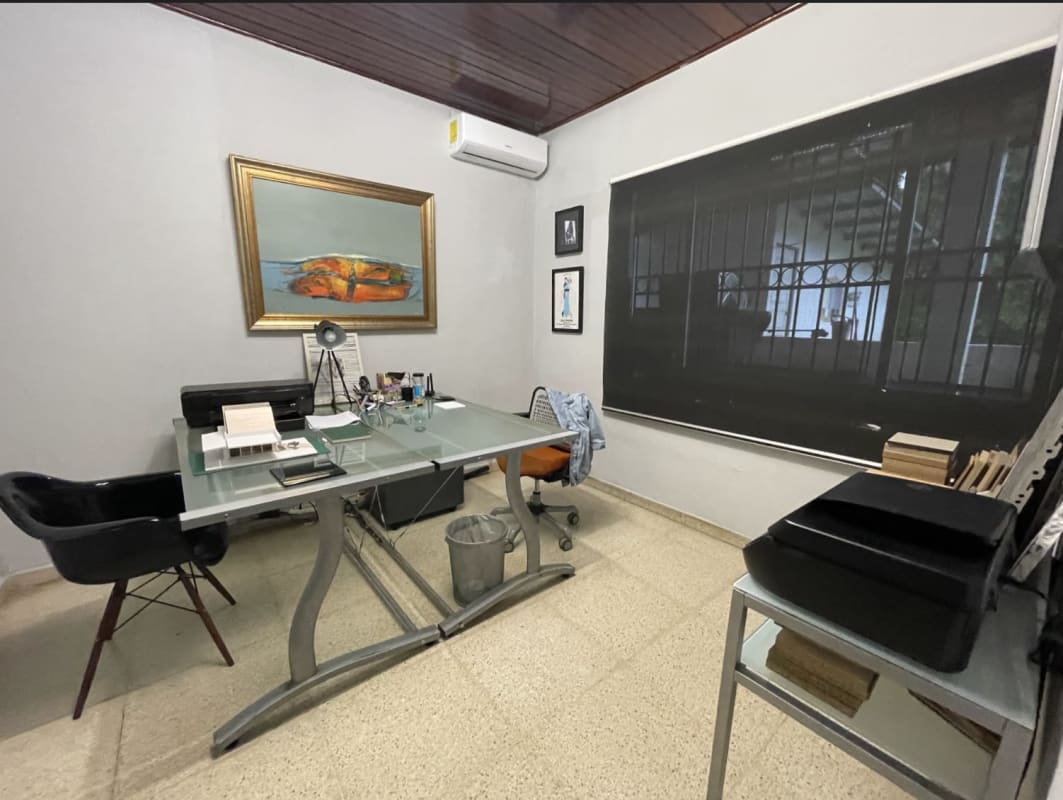 Contemporary office workspace with double desk workstations and glass table in Panama City