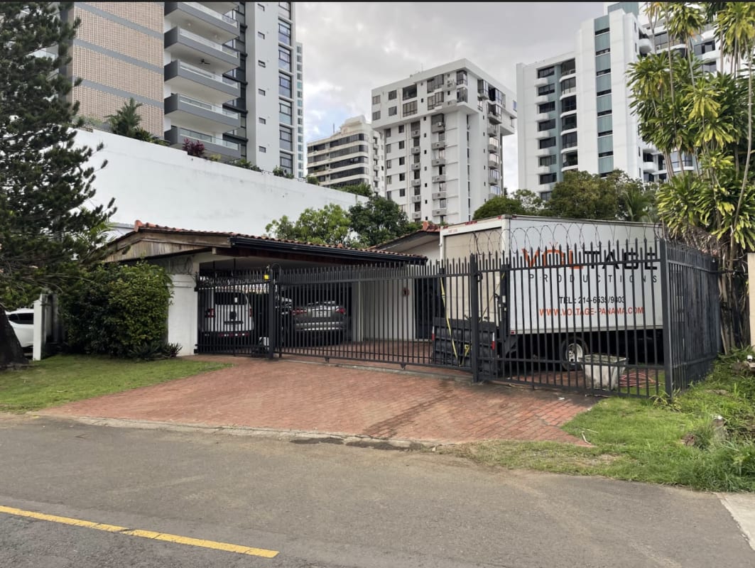 Gated commercial complex with security fencing and driveway entrance in Coco del Mar Panama