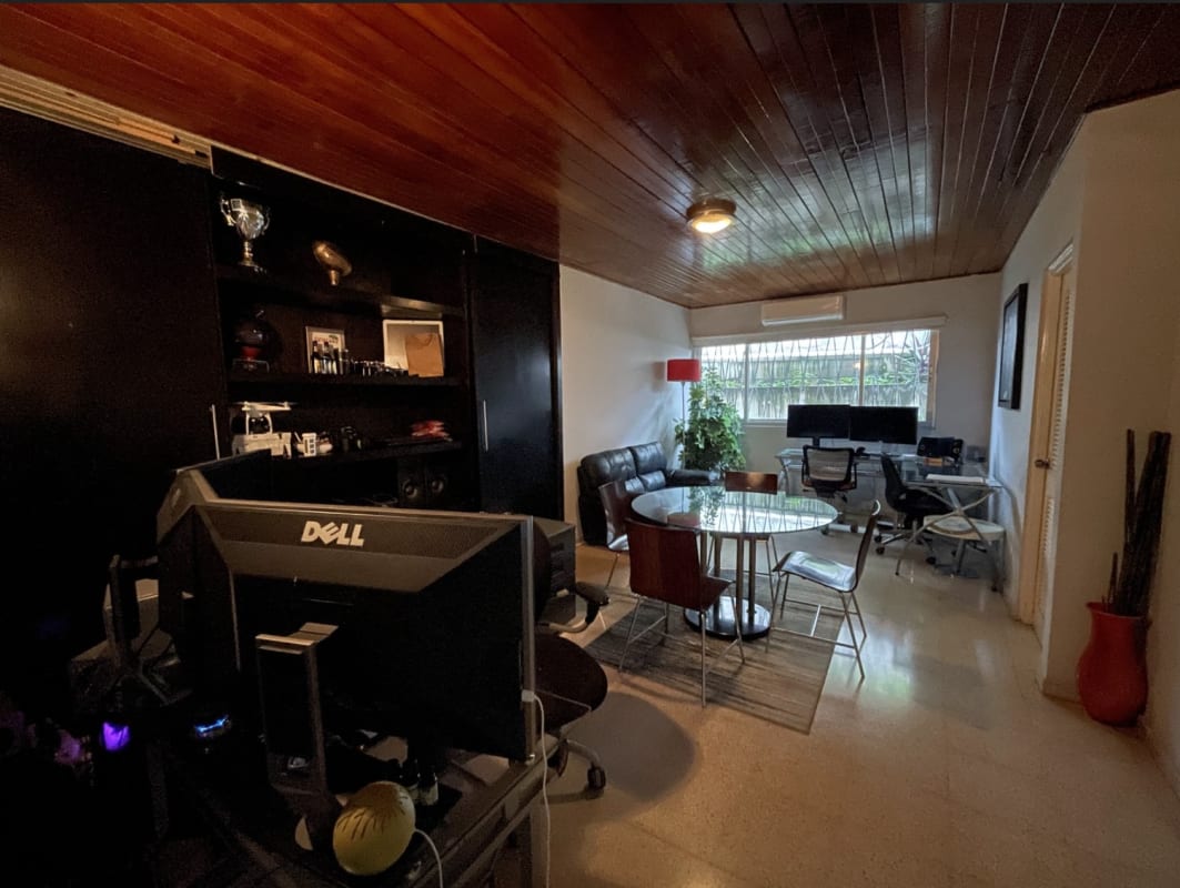 Contemporary meeting office with dual workstations and garden view in Panama City