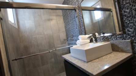 Contemporary bathroom with vessel sink and glass shower at Forest Towers Panama