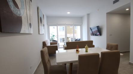 Bright living dining room with large windows balcony at PH Forest Towers Panama Pacifico