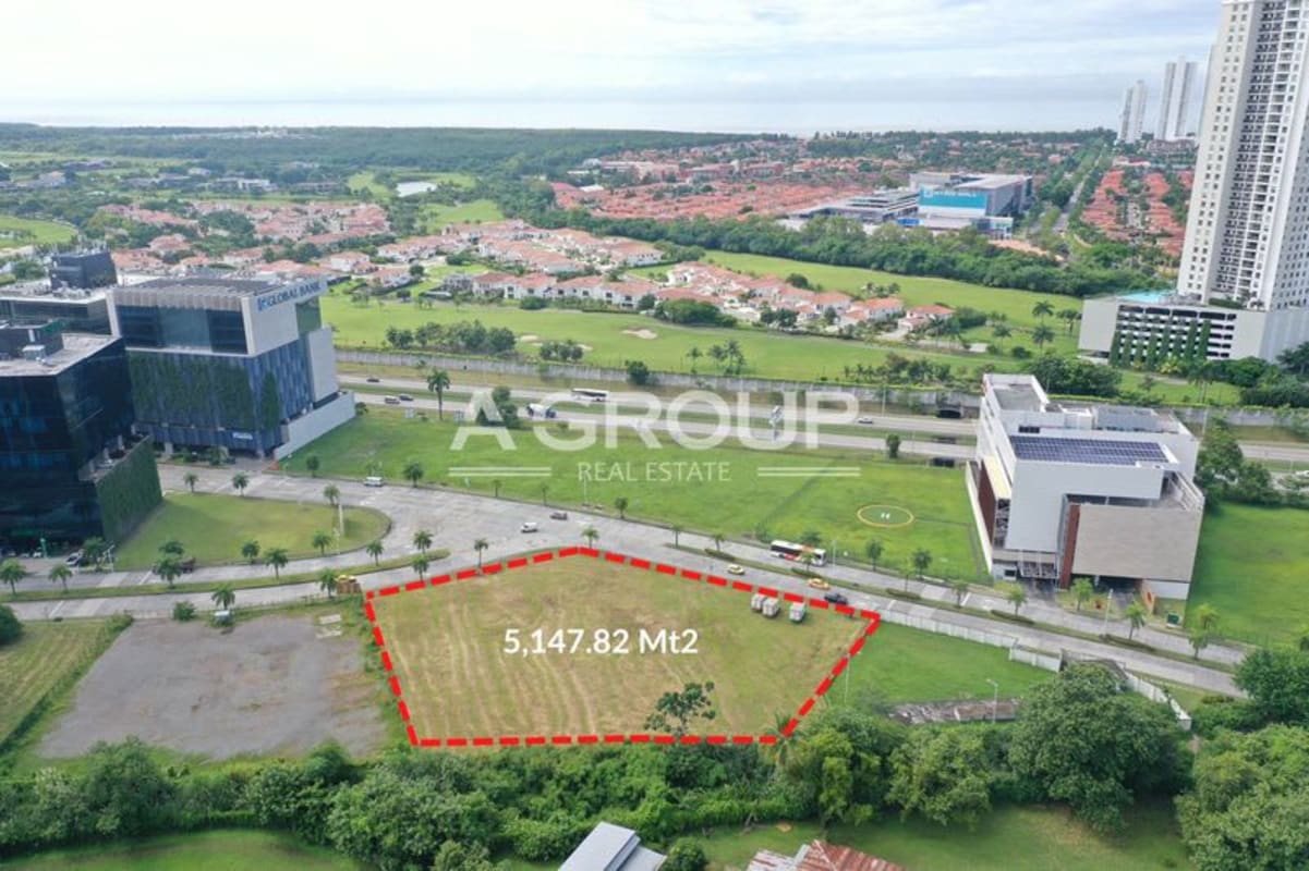 Aerial view vacant plot in Santa Maria Business District with green landscape and commercial buildings nearby in Panama City