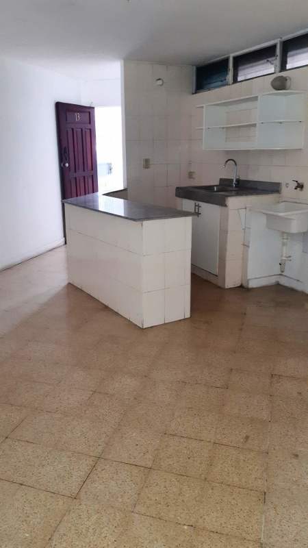 Small kitchen with tile counters and open shelves PH El Conquistador Panama City