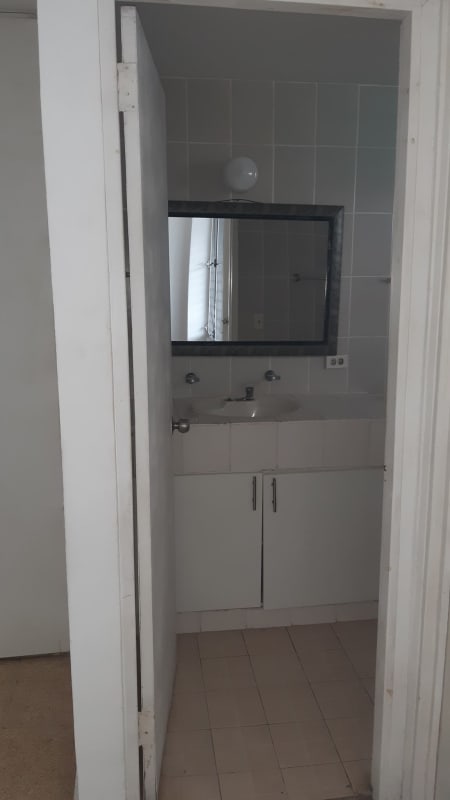 Minimalist bathroom tiled with walk-in shower PH El Conquistador Panama City