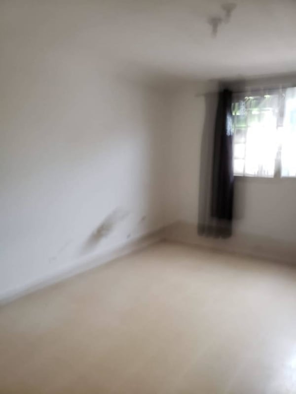 Bright corridor with ceramic tile floors and white walls Villa Lucre Panama