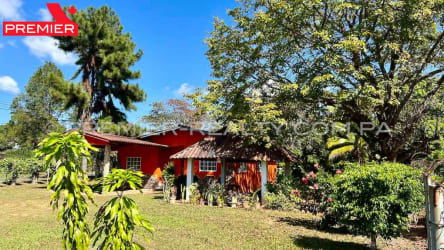 Bright orange countryside house with garden and gazebo near Santa Clara Panama