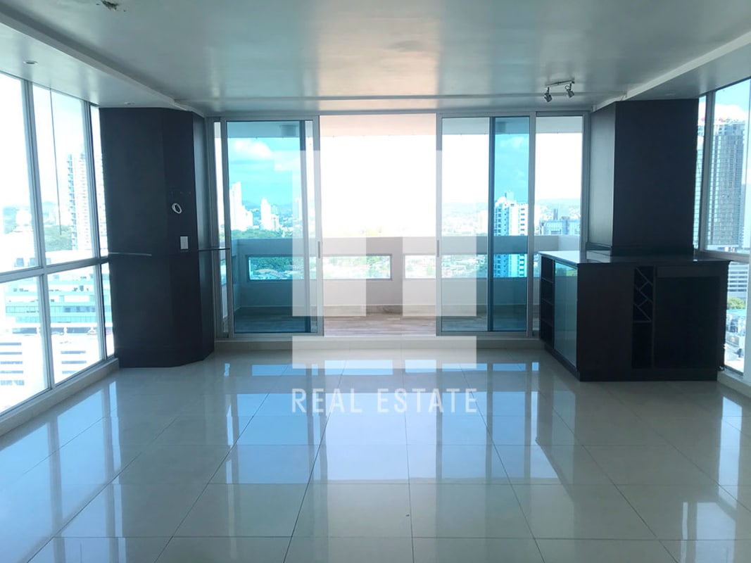 Open plan living dining with large windows, balcony access and skyline views PH The View Panama City