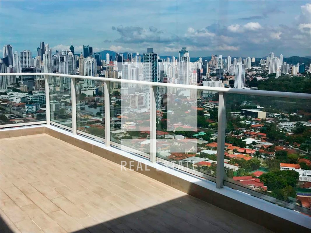 Spacious open penthouse living area with panoramic ocean and city skyline view in PH Puntarenas Coco del Mar Panama