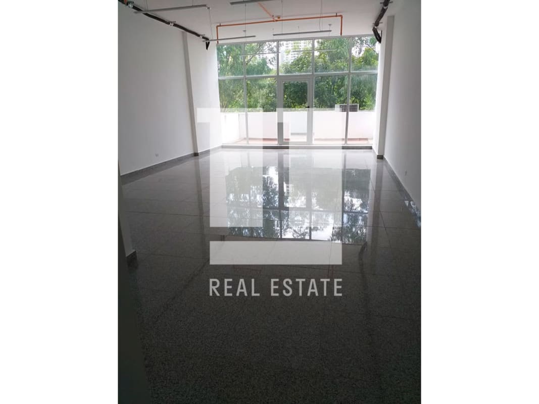 Spacious commercial interior with large windows, granite floors, high ceiling in Peninsula Center Panama