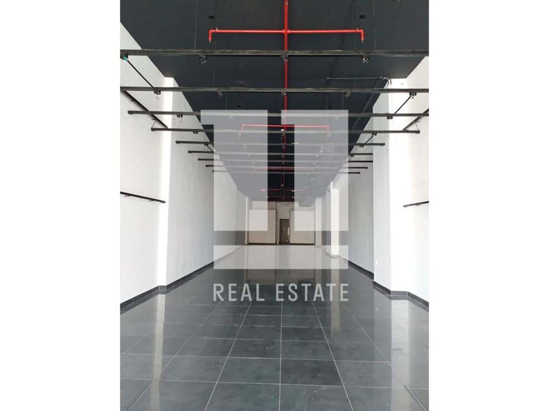 Interior commercial unit with black ceiling design, gray tile floor, sprinkler system, minimalist style in Peninsula Center