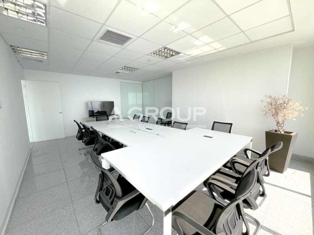 Glass walled office interior with ocean view in BICSA Tower Panama