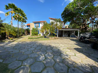 Large family kitchen with island, white cabinetry, rustic beams in Punta Barco villa Panama