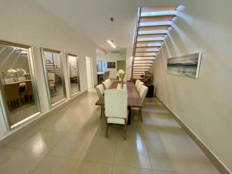 Dining area modern staircase Casamar beach villa for sale San Carlos Panama