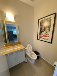 Open kitchen with breakfast island granite counters in Casamar Villamar duplex Panama