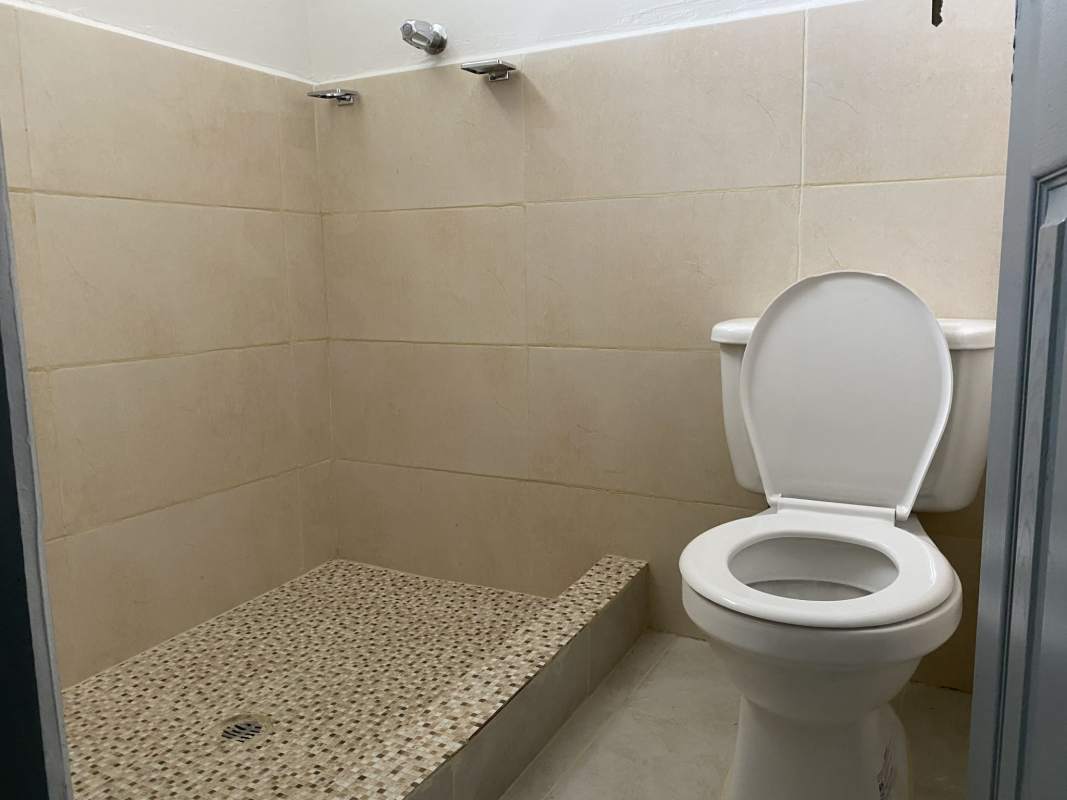 Minimalist bathroom with walk-in shower beige tiles Nuevo Tocumen house rental