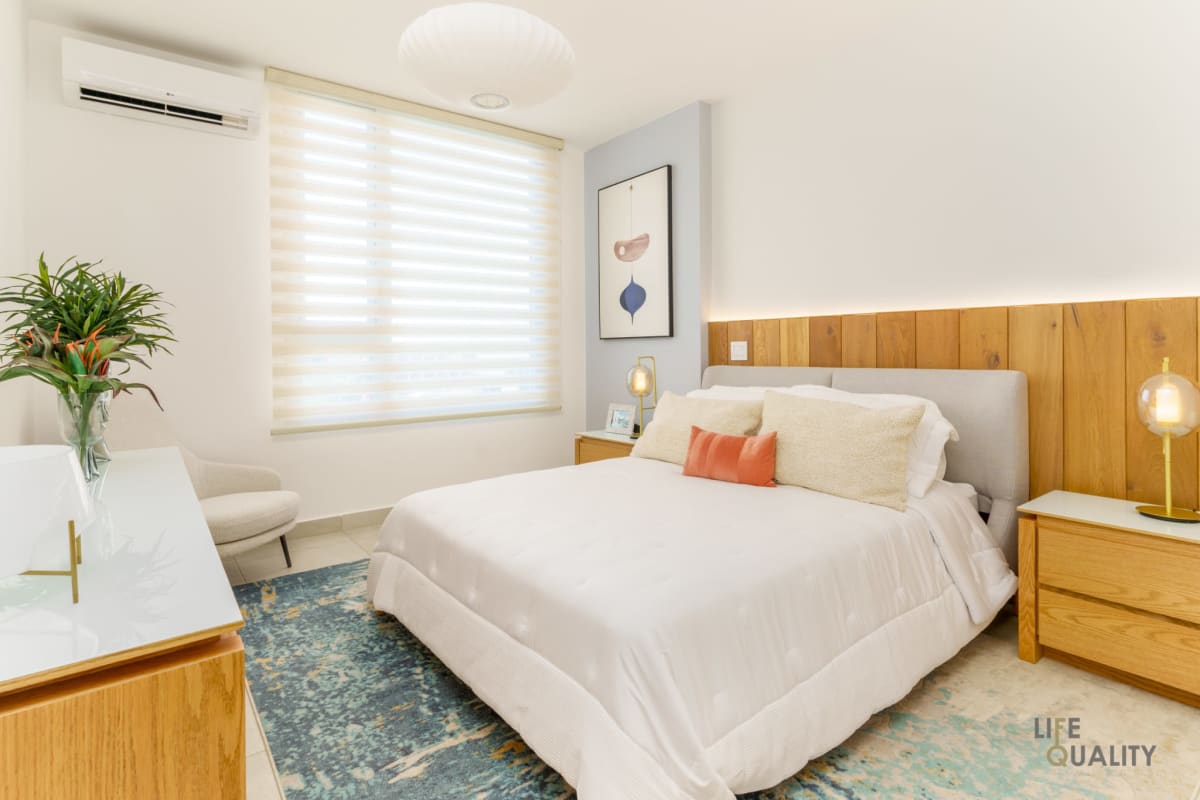 Modern galley kitchen with built-in appliances and wood accents at PH Vista Hermosa Panama