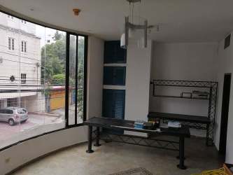 Spacious internal office area with large curved window and built-in shelving Aguadulce Panama