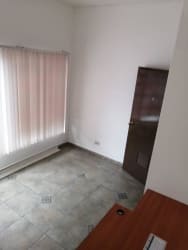 Reception lobby with pass-through window in commercial office building Aguadulce