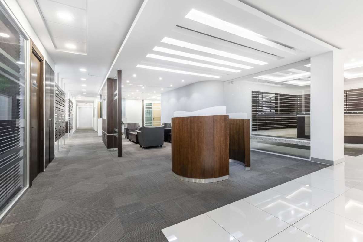 Contemporary lobby with wooden reception desk, glass walls, sleek design in Tower Bank Panama