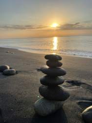 Tropical beachfront property with palm trees, sandy shore and ocean waves in Costa Esmeralda San Carlos Panama.