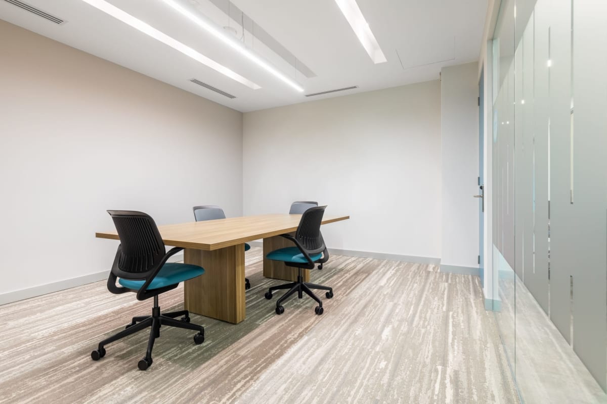 Conference space with frosted glass accent wall carpet flooring modern design Banistmo Tower